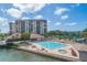 Community pool overlooking the bay, near the building at 9525 Blind Pass Rd # 508, St Pete Beach, FL 33706