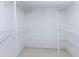 Walk-in closet with metal shelving at 9525 Blind Pass Rd # 508, St Pete Beach, FL 33706