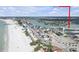 Stunning aerial view showcases the beachfront location and the nearby intercoastal waterway at 9815 Harrell Ave # 502, Treasure Island, FL 33706