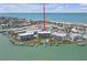Stunning aerial view of beachfront condos with lush landscaping, docks, and pristine gulf coast beaches at 9815 Harrell Ave # 502, Treasure Island, FL 33706
