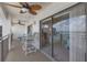 Balcony featuring ceiling fans and views of the bay through sliding glass doors at 9815 Harrell Ave # 502, Treasure Island, FL 33706