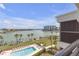Enjoy a stunning waterfront view from your private balcony, overlooking the pool and marina at 9815 Harrell Ave # 502, Treasure Island, FL 33706