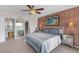 Cozy bedroom with a mirrored closet and balcony access with water views at 9815 Harrell Ave # 502, Treasure Island, FL 33706