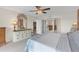 Well-lit bedroom showcasing a dresser and mirrored closet with an ensuite at 9815 Harrell Ave # 502, Treasure Island, FL 33706