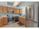 Updated kitchen featuring stainless steel appliances, light wood cabinetry, and bright natural light at 9815 Harrell Ave # 502, Treasure Island, FL 33706