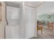 Convenient in-unit stacked washer and dryer with an adjoining closet and living area at 9815 Harrell Ave # 502, Treasure Island, FL 33706