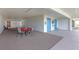 Community patio area with outdoor seating and storage units for resident use at 9815 Harrell Ave # 502, Treasure Island, FL 33706
