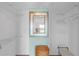 Walk-in closet with a large mirror, wire shelving and a storage basket at 9815 Harrell Ave # 502, Treasure Island, FL 33706