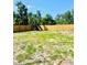 Expansive backyard offers ample space for outdoor activities and gardening with a wooden fence at 1002 E North Bay St, Tampa, FL 33603