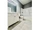 Bathroom boasts a modern vanity, sleek fixtures, and a shower-tub combo for a serene experience at 1002 E North Bay St, Tampa, FL 33603