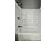 Clean bathtub with shower head and storage built into the tub's plastic surround at 1002 E North Bay St, Tampa, FL 33603