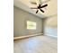 Bedroom with natural light, a ceiling fan, and wood flooring, providing a comfortable space at 1002 E North Bay St, Tampa, FL 33603