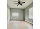 This bedroom features great natural light, a ceiling fan, and a closet at 1002 E North Bay St, Tampa, FL 33603