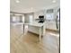 Modern kitchen featuring white cabinets, stainless steel appliances, and a center island at 1002 E North Bay St, Tampa, FL 33603