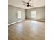Spacious living room featuring neutral walls, wood-look floors, and natural light from multiple windows at 1002 E North Bay St, Tampa, FL 33603