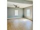 Bright living room featuring neutral walls, wood-look floors, and natural light from multiple windows at 1002 E North Bay St, Tampa, FL 33603
