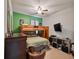 Fun bedroom features a bunk bed, ceiling fan, and wall-mounted TV for cozy relaxing at 10404 Scarlet Chase Dr, Riverview, FL 33569