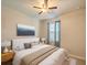 Comfortable bedroom features a ceiling fan, and soothing decor for restful nights at 10404 Scarlet Chase Dr, Riverview, FL 33569