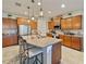 Bright kitchen with granite counters, center island, stainless steel appliances, and wooden cabinetry at 10404 Scarlet Chase Dr, Riverview, FL 33569