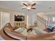 Comfortable living room featuring a large leather sectional sofa and tile floors at 10404 Scarlet Chase Dr, Riverview, FL 33569