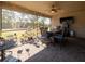 Spacious, screened lanai with a dining set, ceiling fan, and views of the backyard at 10404 Scarlet Chase Dr, Riverview, FL 33569