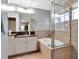 Relaxing bathroom features a separate tub and shower with glass door enclosure at 10501 Dotham Ct, Tampa, FL 33626