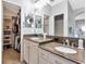 Spacious bathroom features dual sinks with granite countertops and walk-in closet at 10501 Dotham Ct, Tampa, FL 33626