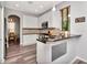 Modern kitchen with white cabinets, stainless steel appliances, and granite countertops at 10501 Dotham Ct, Tampa, FL 33626