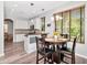 Eat-in kitchen featuring stainless steel appliances, a breakfast bar and a modern light fixture at 10501 Dotham Ct, Tampa, FL 33626