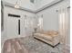 Inviting living room with ample natural light, neutral paint, and wood-look flooring at 10501 Dotham Ct, Tampa, FL 33626