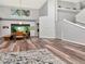 Open-concept living and dining area with abundant natural light and a staircase in the background at 10501 Dotham Ct, Tampa, FL 33626