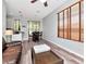 Open-concept living room with wood flooring, cozy seating, and natural light at 10501 Dotham Ct, Tampa, FL 33626