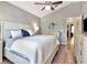 Serene main bedroom with ceiling fan, ensuite bathroom, and neutral wall color at 10501 Dotham Ct, Tampa, FL 33626