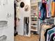Spacious walk-in closet with custom shelving and ample storage for clothes, shoes, and accessories at 10501 Dotham Ct, Tampa, FL 33626