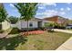 Charming one-story home with well-maintained lawn, landscaping, and inviting curb appeal at 10603 Massimo Dr, Wimauma, FL 33598