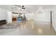 Bright, open-concept space blending living, kitchen, and dining areas with great natural light at 10603 Massimo Dr, Wimauma, FL 33598
