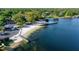 Aerial shot of community beach and pier offering an idyllic waterfront experience at 10609 Orange Grove Dr, Tampa, FL 33618