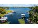 Expansive lake view with multiple boat docks, emphasizing the waterfront lifestyle and boating opportunities at 10609 Orange Grove Dr, Tampa, FL 33618