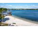 Picturesque beachside with a covered pier, blending recreational space and waterfront relaxation at 10609 Orange Grove Dr, Tampa, FL 33618