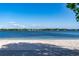 Sandy beach on a clear lake, perfect for relaxation and enjoying waterfront activities and views at 10609 Orange Grove Dr, Tampa, FL 33618