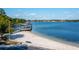 Beautiful beach scene featuring a pier, American flag, and peaceful waterfront ambiance at 10609 Orange Grove Dr, Tampa, FL 33618