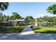 Community Lake featuring boat slips and docks, lush landscaping and a clear view of waterfront homes at 10609 Orange Grove Dr, Tampa, FL 33618