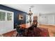 Cozy dining room with natural light, a wooden table, and classic decor at 10609 Orange Grove Dr, Tampa, FL 33618