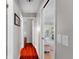 Bright hallway features wood floors, neutral walls, and access to multiple rooms at 10609 Orange Grove Dr, Tampa, FL 33618
