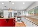 Well-equipped kitchen featuring stainless steel appliances, white cabinets, and granite countertops at 10609 Orange Grove Dr, Tampa, FL 33618
