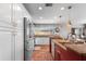 Bright kitchen with stainless steel appliances, granite countertops, and white cabinetry, offering a modern and functional space at 10609 Orange Grove Dr, Tampa, FL 33618