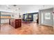 Bright, open-concept kitchen and dining area with ample counter space and modern lighting fixtures at 10609 Orange Grove Dr, Tampa, FL 33618