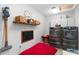 Well-equipped laundry room with modern washer and dryer, storage shelves, and playful decor, perfect for organization at 10609 Orange Grove Dr, Tampa, FL 33618