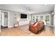 Cozy living room featuring a fireplace, large windows, neutral tones, and an inviting atmosphere perfect for relaxation at 10609 Orange Grove Dr, Tampa, FL 33618