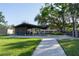 Community park featuring a picnic shelter with tables, bike racks, and green space for outdoor activities at 10609 Orange Grove Dr, Tampa, FL 33618